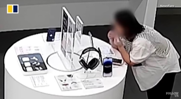 Woman chews anti theft cord to steal phone